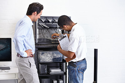 Buy stock photo Server room, man or electrician with working on hardware maintenance after glitch in business office. Network, clipboard or worker with a technician or electrical engineer for information technology