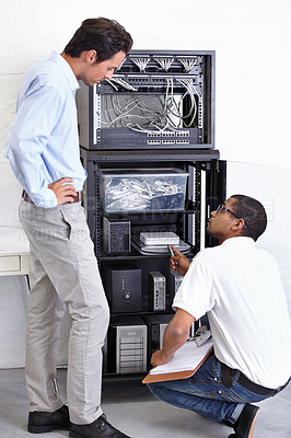 Buy stock photo Server room, businessman or electrician with working on hardware maintenance after glitch in office. Network, clipboard or worker with a technician or electrical engineer for information technology