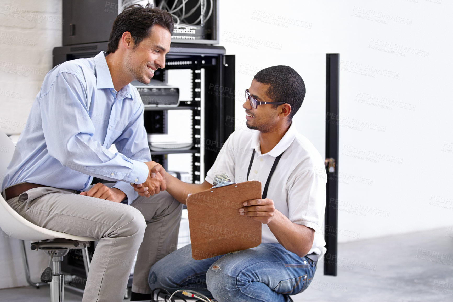 Buy stock photo Server room, man or technician shaking hands for hardware maintenance success or fixing glitch in office. Handshake, contract or happy worker with an electrician or engineer for IT support or deal