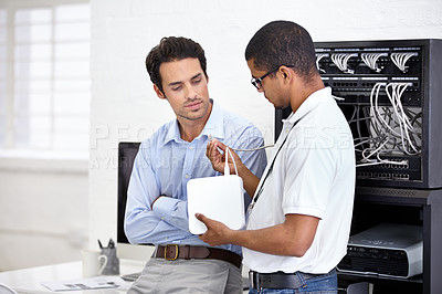 Buy stock photo A young IT specialist ready to fix a server