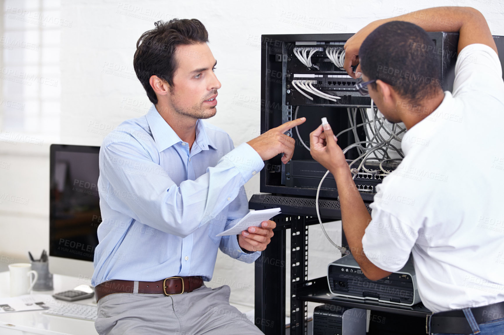 Buy stock photo Hardware, information technology and engineering professional men repair motherboard in server room. Manufacturing or service, maintenance or technician and male coworkers support in office.