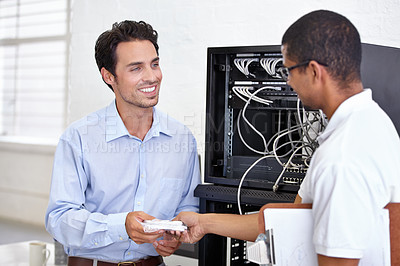 Buy stock photo Server room, man or technician giving modem hardware for maintenance for connection in business office. Electronics, help or worker with an electrician or tech support for information technology