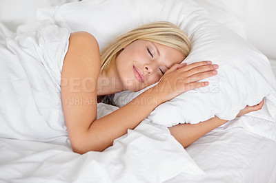 Buy stock photo Sleep, relax and comfort with a woman in bed during the morning while in luxury hotel accommodation on vacation. Sleeping, hospitality and rest with a young female person lying in a bedroom at home