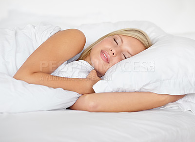 Buy stock photo Woman, bedroom and sleeping with rest, peaceful and dreaming in bed, resting and Apartment in morning. Wellness, blanket and eyes closed on pillow, young female asleep in house on weekend with face