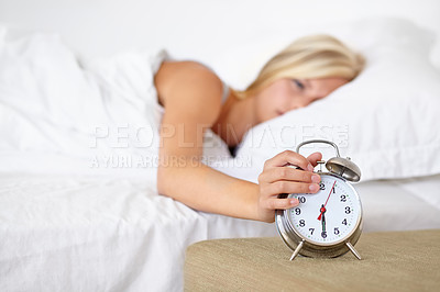 Buy stock photo Alarm, clock and woman wake up in morning on bed in home with fatigue and rest. Press, snooze and girl frustrated with time and tired start to day in bedroom and routine in apartment with timer