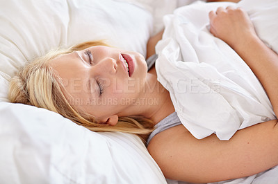 Buy stock photo Woman, bedroom and sleeping with face, relax and dreaming in bed, resting and Apartment in morning. Tired, blanket and eyes closed on pillow, young female asleep in house on weekend with fatigue