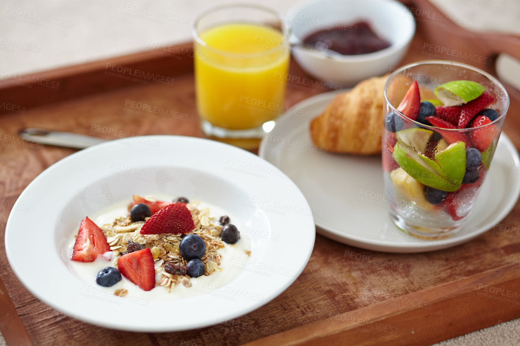 Buy stock photo Food, wellness and closeup of breakfast tray with muesli for balance, benefits or gut health. Fruit, zoom and croissant with vitamins for diet, nutrition or healthy eating, brunch or superfoods salad