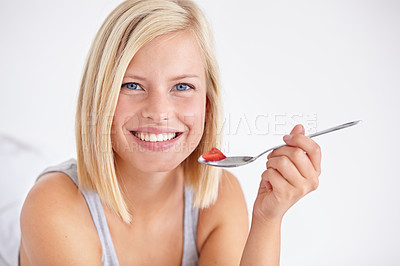 Buy stock photo Portrait, happy woman and eating fruit salad, healthy diet or  nutrition in home bedroom. Face smile, spoon or person with strawberry, hungry for breakfast or organic food for wellness in the morning