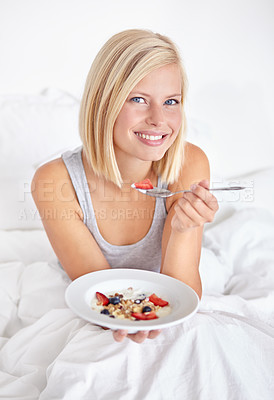 Buy stock photo Woman, portrait and breakfast in bedroom, happy and awake in morning hospitality or accommodation. Enjoying food and holiday with young person in bed of home, weekend and comfortable with cereal bowl