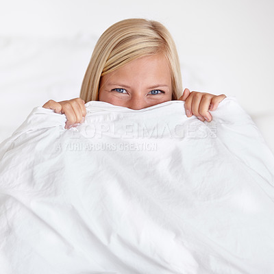Buy stock photo Portrait, eyes and happy woman in a bed with blanket, hiding or waking up playful in her home. Morning energy, face and cute female person with good mood, attitude or positive mindset in a bedroom 