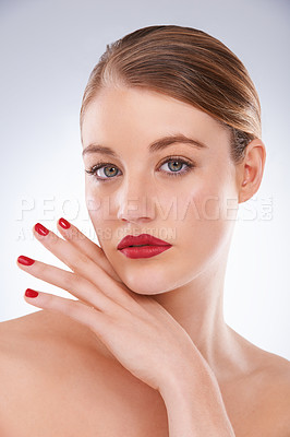 Buy stock photo Woman, portrait and makeup in studio with red lipstick for cosmetics, beauty and aesthetic with nail polish. Model, person and confidence with skincare, glowing face and wellness on white background