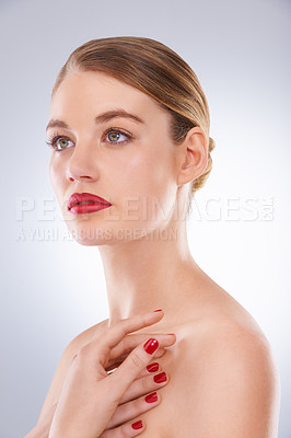 Buy stock photo Portrait of an attractive young woman wearing bright red lipstick and nail polish