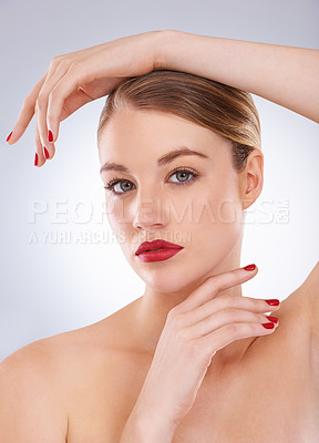 Buy stock photo Woman, portrait and skincare in studio with red lipstick for cosmetics, beauty and aesthetic with nail polish. Model, person and confidence with makeup, glowing face and wellness on white background
