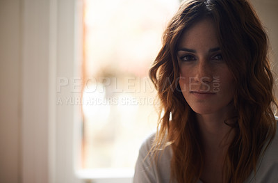 Buy stock photo Cropped portrait of a casual young brunette at home