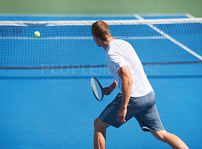 Buy stock photo Sport, man and tennis on court with fitness, competition and performance outdoor with serve and energy. Athlete, player and ball on turf for training, exercise and racket with skill, game or wellness
