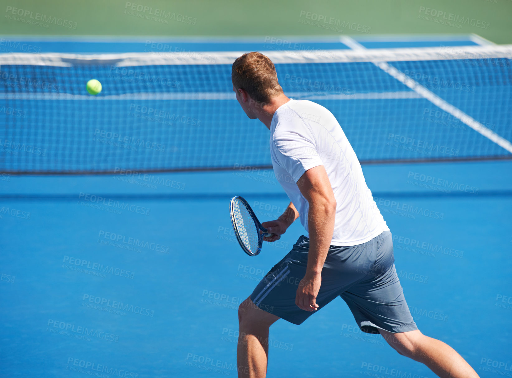 Buy stock photo Sport, man and tennis on court with fitness, competition and performance outdoor with serve and energy. Athlete, player and ball on turf for training, exercise and racket with skill, game or wellness