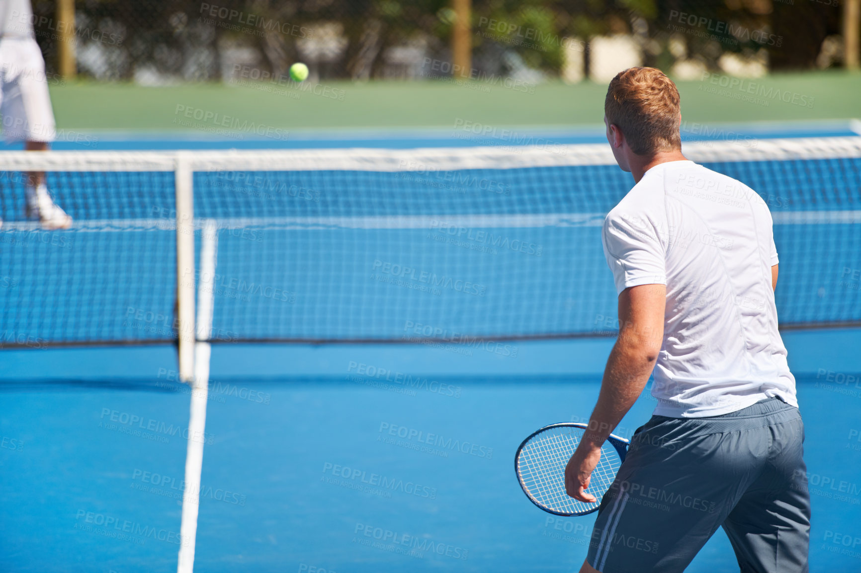 Buy stock photo Sport, man and tennis on court with workout, competition and performance outdoor with fitness and energy. Athlete, player and ball on turf for training, exercise and racket with skill, game and hobby