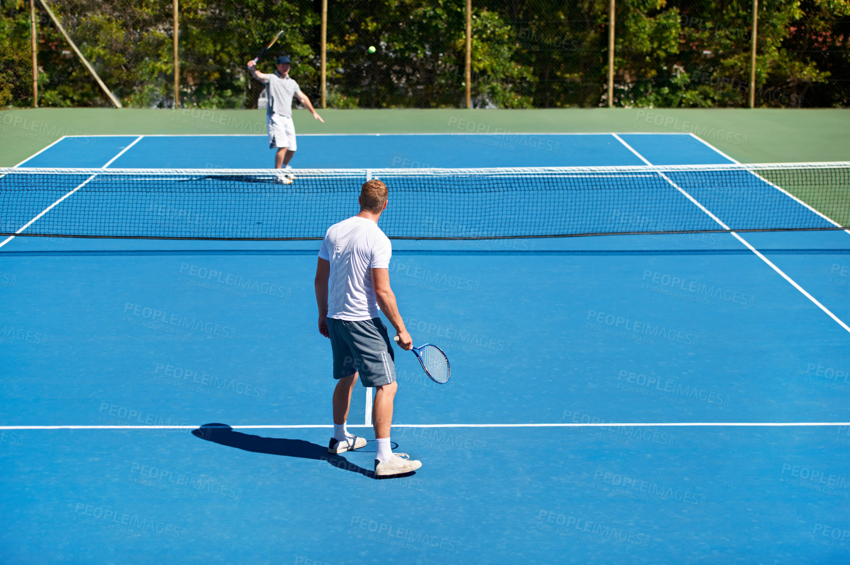Buy stock photo People playing tennis on a tennis court