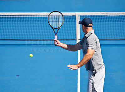 Buy stock photo Fitness, man and tennis on court with serve, competition and performance outdoor with sport and energy. Athlete, player and ball on turf for training, exercise and racket with skill, game and hobby
