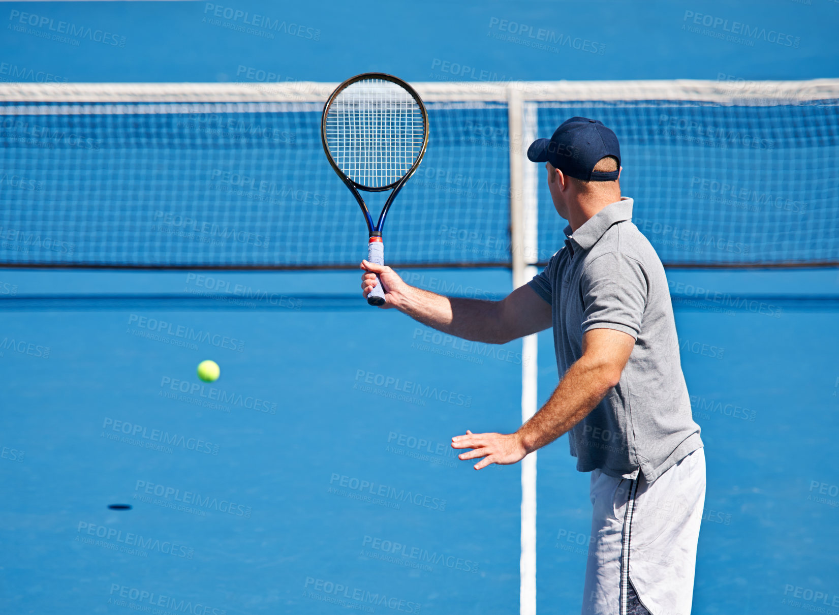Buy stock photo Fitness, man and tennis on court with serve, competition and performance outdoor with sport and energy. Athlete, player and ball on turf for training, exercise and racket with skill, game and hobby