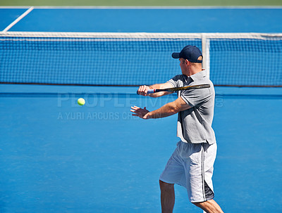 Buy stock photo Sport, man and tennis on court with training, competition and performance outdoor with fitness and energy. Athlete, player and ball on turf for serve, exercise and racket with skill, game and hobby