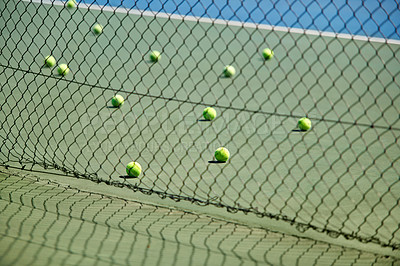 Buy stock photo Sport, fitness or tennis balls on floor for training, exercise or competitive match to start in summer. Green, background or court for health or hobby with equipment on the ground ready for a game