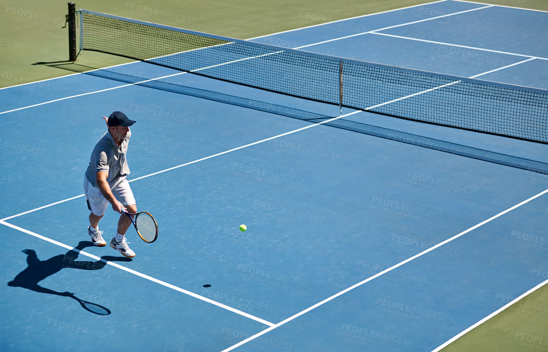 Buy stock photo Sport, man and tennis on court with fitness, competition and performance outdoor with match and energy. Power, athlete and ball on turf for training, health and racket with skill, game or hobby