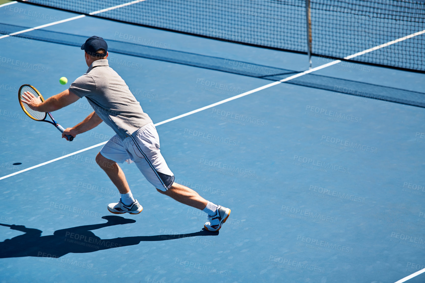 Buy stock photo Sport, man and tennis on court with fitness, competition and performance outdoor with match and energy. Athlete, player and ball on turf for training, exercise and racket with skill, game and hobby