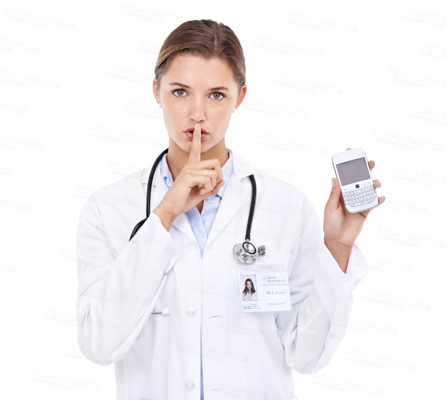 Buy stock photo Portrait of an attractive young doctor telling you to be quiet while holding a cellphone