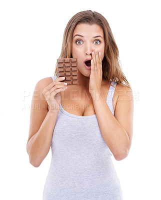 Buy stock photo Woman, shocked and portrait with chocolate, candy and sweet tooth with surprise for craving sugar in studio. Hungry, snack and meal for comfort, dessert and sweets for calories, diet and wow
