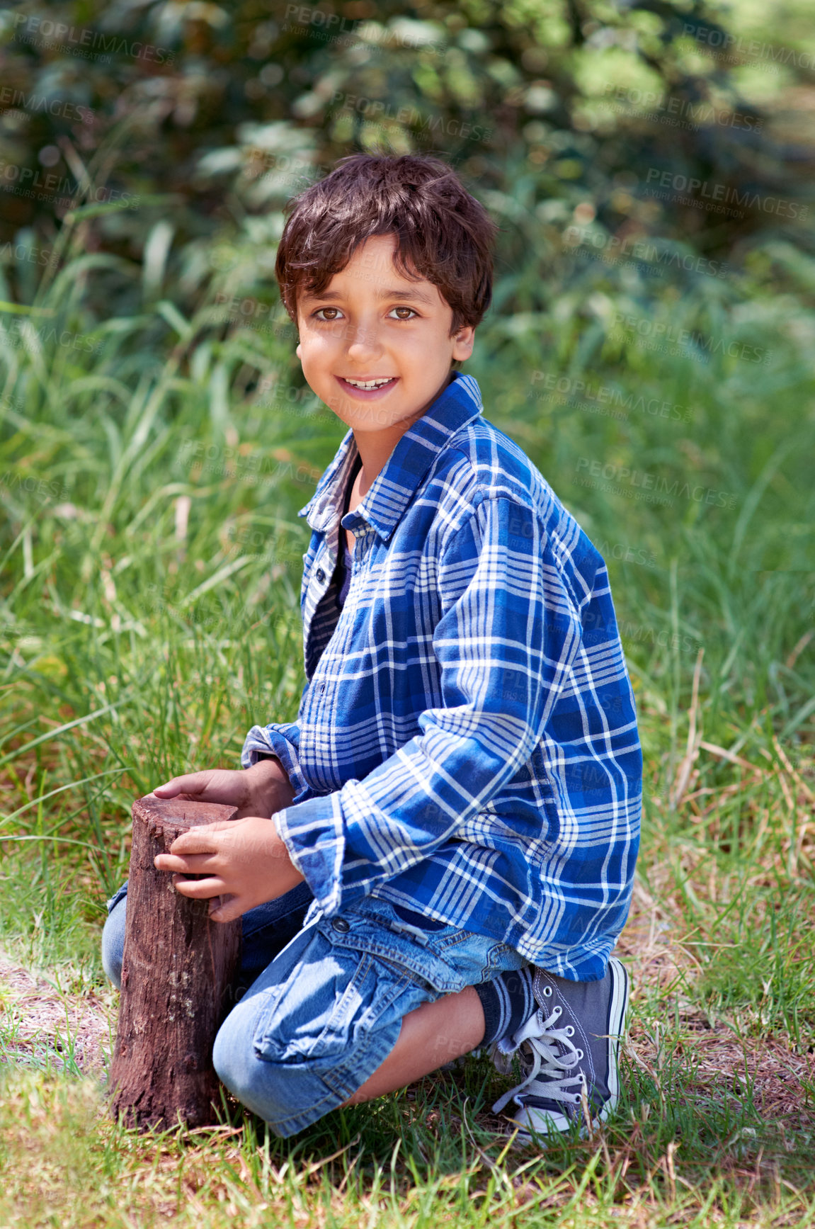 Buy stock photo A young boy playing outside
