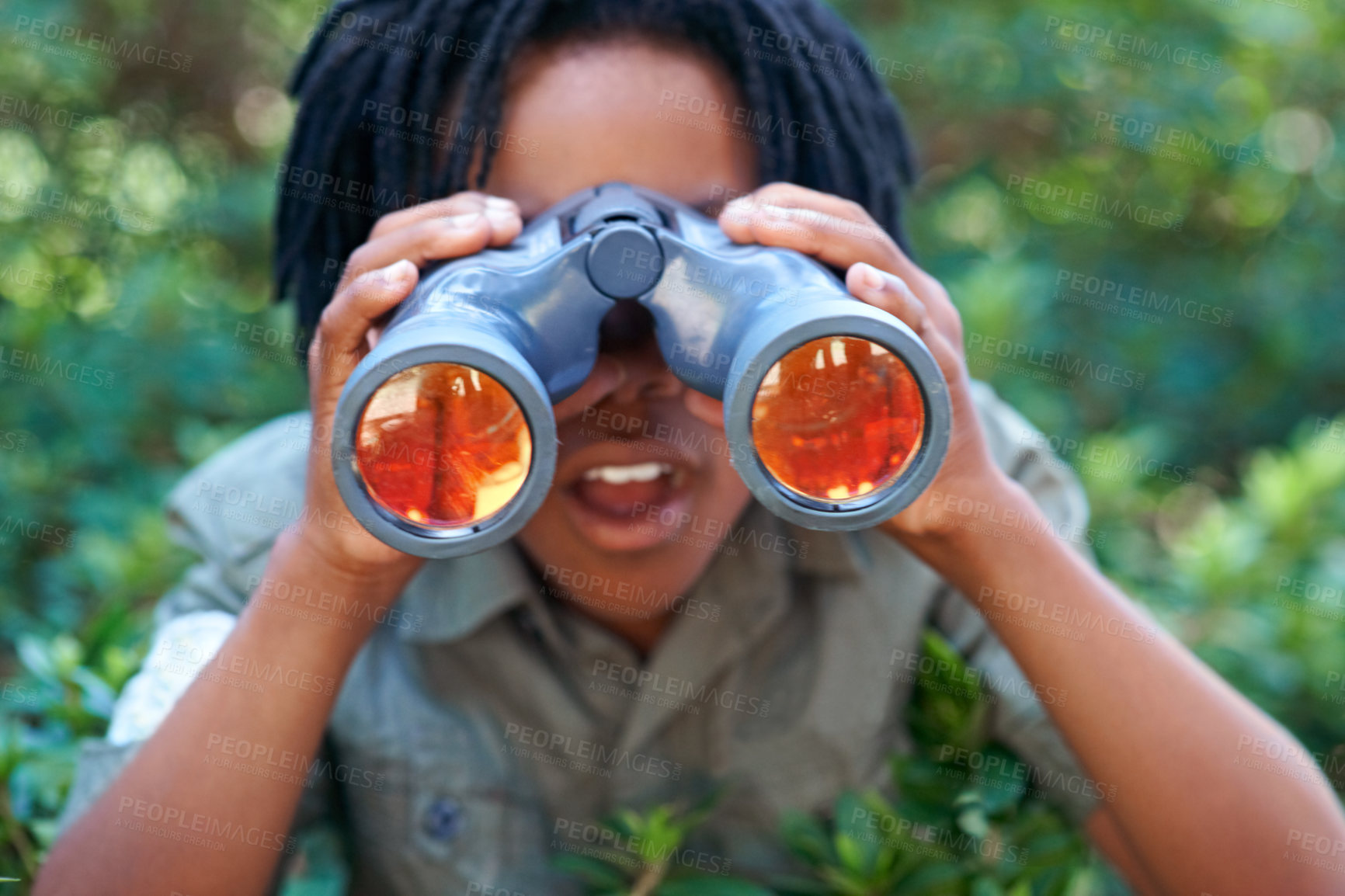 Buy stock photo Boy, kid with binoculars and surprise, search in nature for learning and fun, forest and adventure at summer camp. Young African camper, leaves and explore environment outdoor with wow for discovery