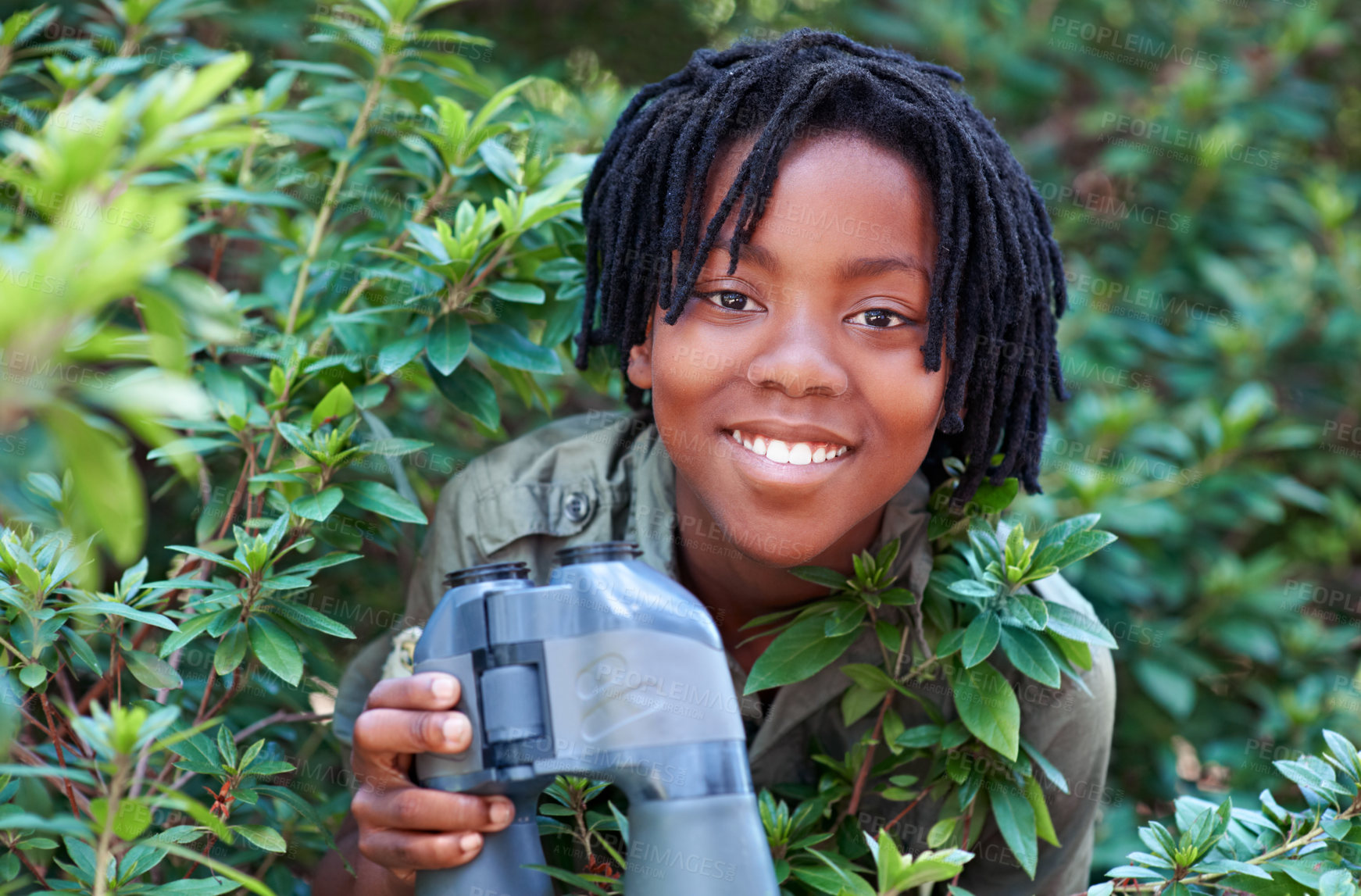 Buy stock photo Nature portrait, binocular and black child happiness for travel adventure, outdoor exploration or bird watching trip. Tree leaf, face or African kid on search journey in forest, woods or eco jungle