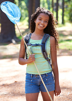 Buy stock photo Girl, kid and butterfly net in forest for adventure and hiking outdoor, smile in portrait and backpacking. Travel, young explorer and happy in environment for trekking and explore nature for insects