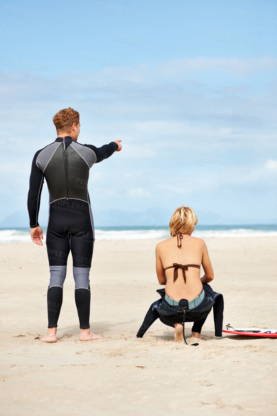 Buy stock photo Surfing, beach and friends pointing with surfboard for water sports, fitness and exercise by ocean. Nature, direction and man and woman with hand gesture on holiday, vacation and adventure by sea