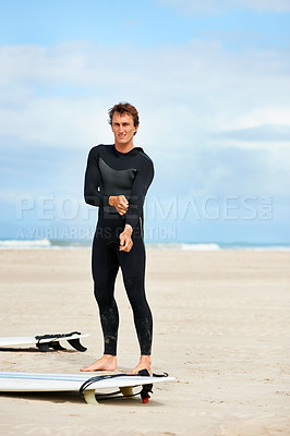 Buy stock photo Surfer, man and portrait with surfboard on beach with wetsuit, blue sky or dressing with mock up space. Extreme sports, athlete and person by ocean for training, surfing workout or holiday adventure 