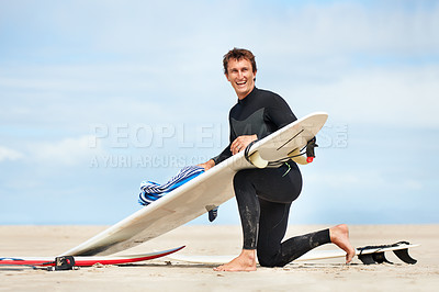 Buy stock photo Surfer, man and portrait with surfboard on beach with wetsuit, blue sky and cleaning with mock up space. Extreme sports, athlete and person by ocean for training, surfing workout and towel with smile
