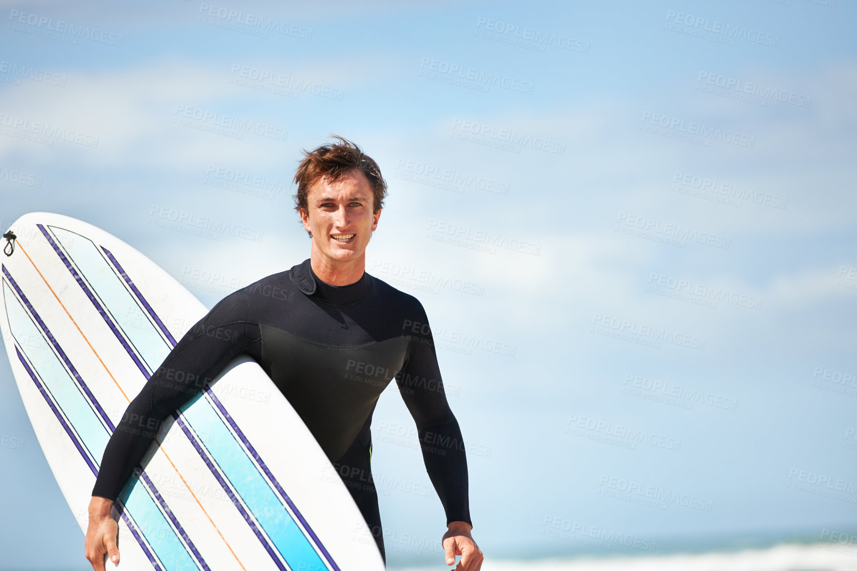 Buy stock photo Portrait of a young surfer at the beach on a sunny day