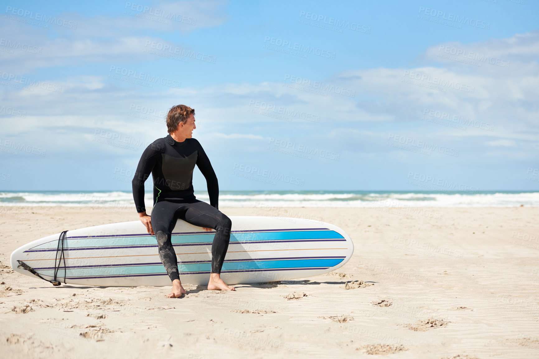 Buy stock photo Surfing, thinking and happy man with surfboard on beach for water sports training, freedom and fitness outdoors. Nature, blue sky and person for adventure on holiday, vacation and hobby by ocean