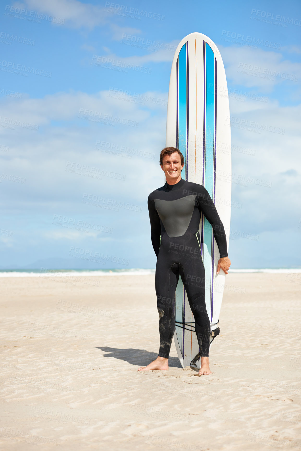 Buy stock photo Beach, portrait and happy man with surfboard in summer for exercise, fitness for body health or outdoor mockup. Surfer, wetsuit and smile of person by ocean for water sports, travel or holiday by sea