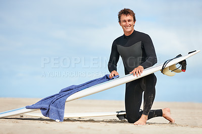 Buy stock photo Surfer, man and portrait with surfboard by ocean with wetsuit, blue sky and cleaning with mock up space. Extreme sports, athlete and person on beach for training, surfing workout and towel with smile