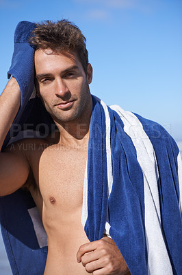 Buy stock photo Serious, beach and portrait of man with towel for swimming in ocean on vacation, holiday or adventure. Travel, handsome and young person by sea with confidence for summer weekend trip in Australia.