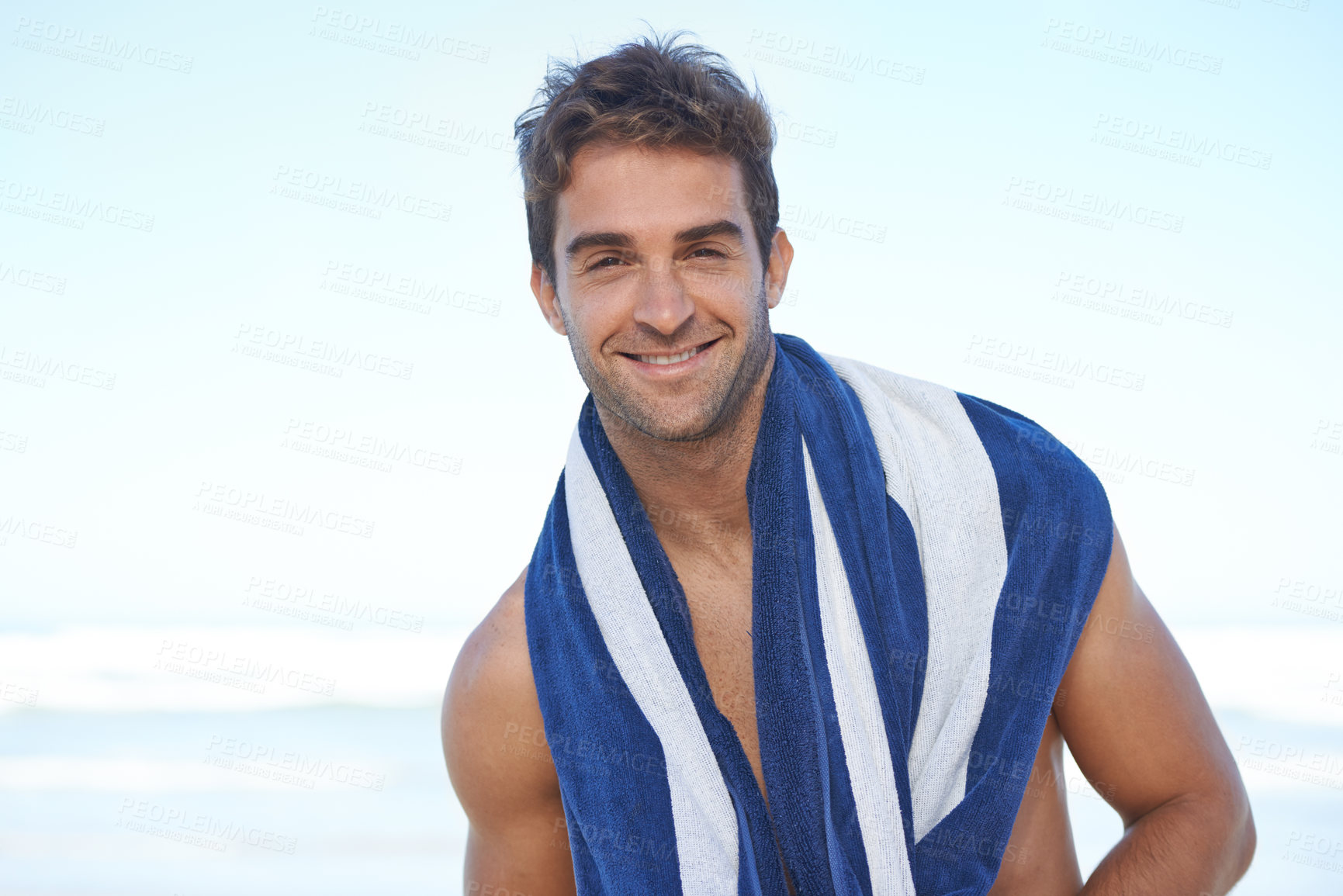 Buy stock photo Happy, beach and portrait of man with towel for swimming in ocean on vacation, holiday or adventure. Smile, handsome and young male person by sea with confidence for summer weekend trip in Australia.