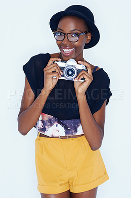 Buy stock photo Black woman, photographer and portrait in studio with smile, creativity and camera for talent and creative artist career. Student, happiness and face for photography and glasses by white background