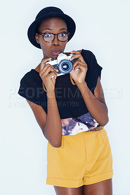 Buy stock photo Woman, shocked and photographer in portrait in studio, creativity and talent for artist in creative job. African person, design or face in photoshoot by camera or surprise by lens on white background