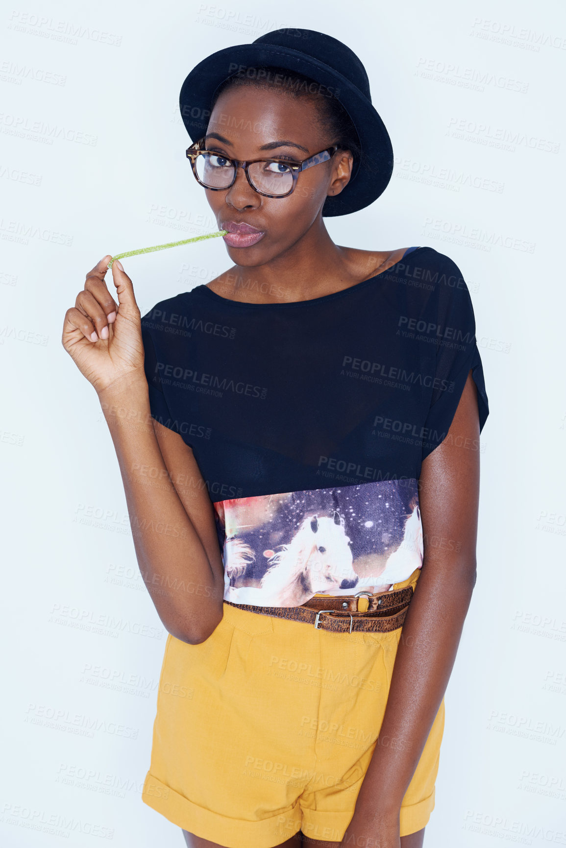 Buy stock photo A young woman posing against white
