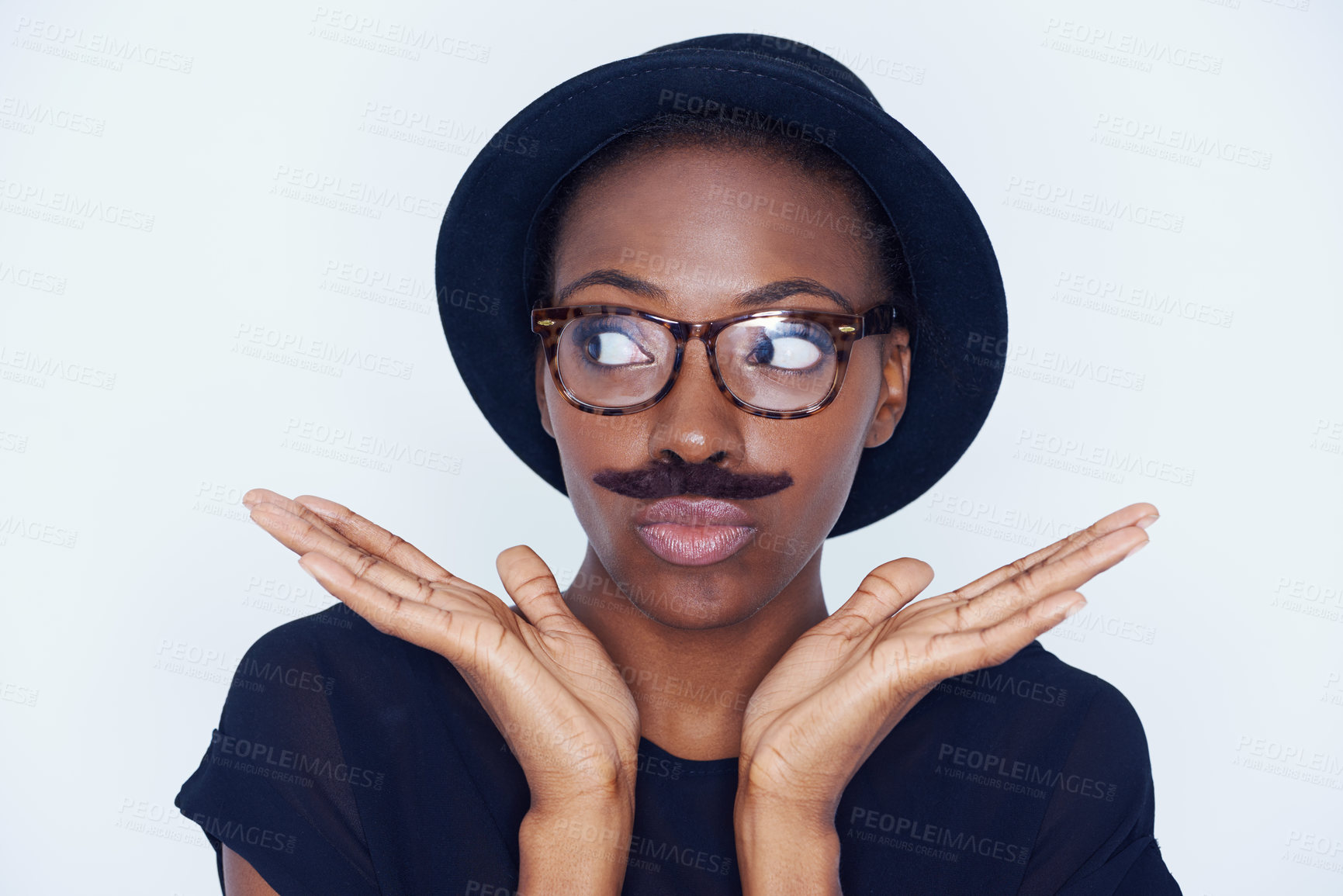 Buy stock photo Funny, woman and mustache on face in studio with hipster fashion and creative model in background or mockup. Silly, nerd and African person with goofy style and joke with trendy hat or unique outfit