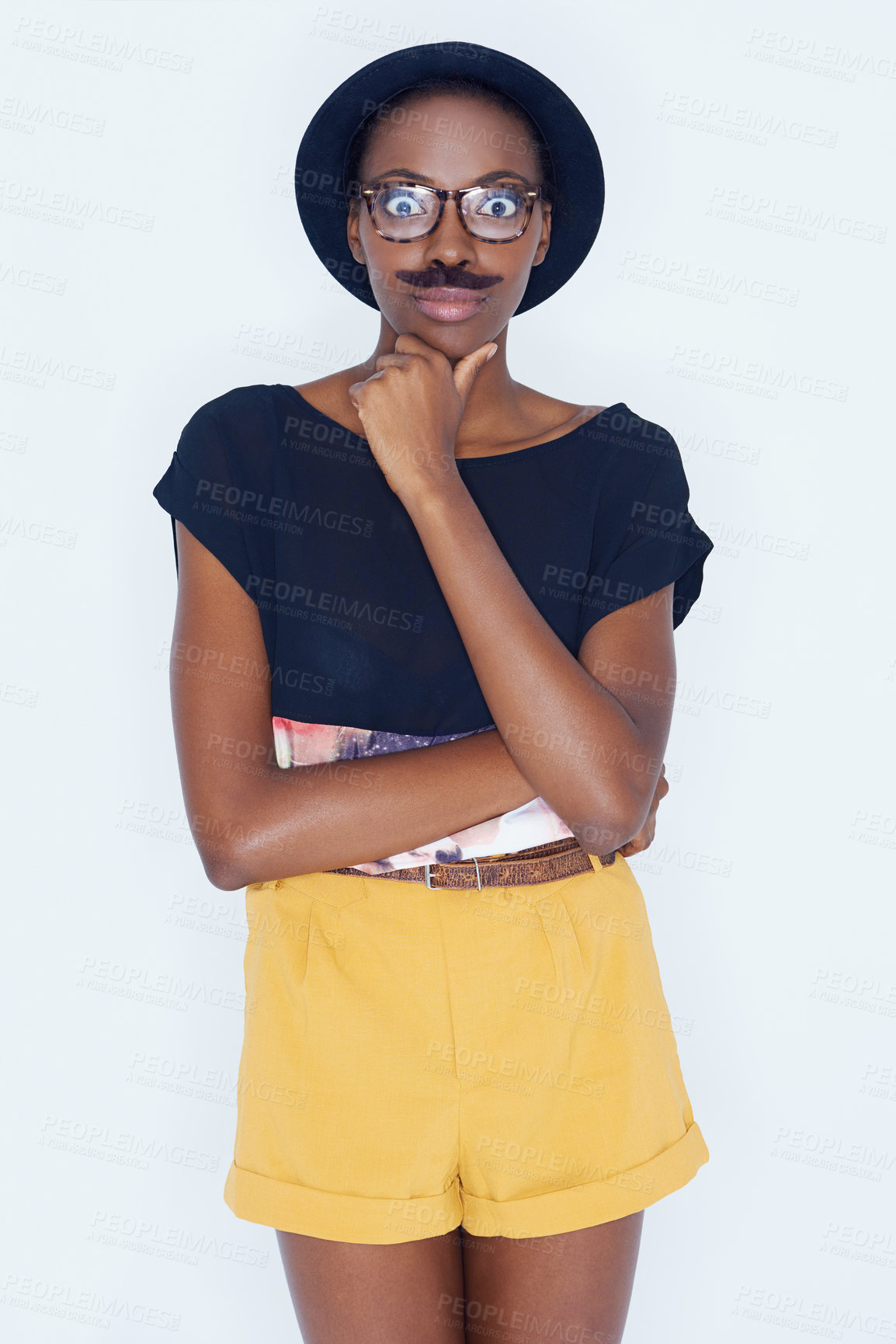 Buy stock photo Funny, portrait and black woman with mustache in studio with hipster fashion and crazy person in background. Silly, nerd and geek with goofy style and comedy joke with trendy hat or unique outfit