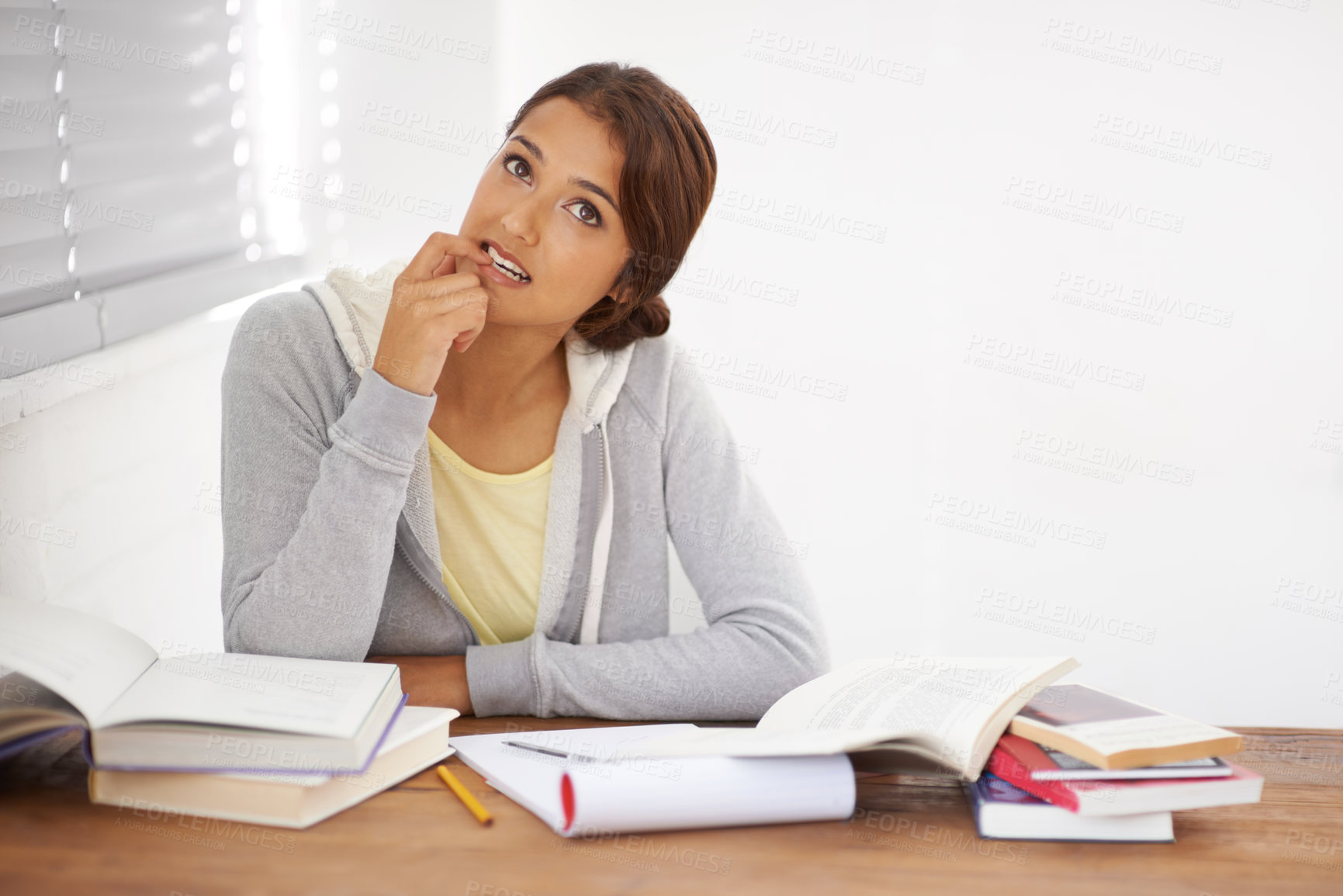 Buy stock photo Student, woman and thinking with books for learning, knowledge or education with idea for study in bedroom.
Young person, girl and thoughtful at desk with novel for scholarship, project or assessment