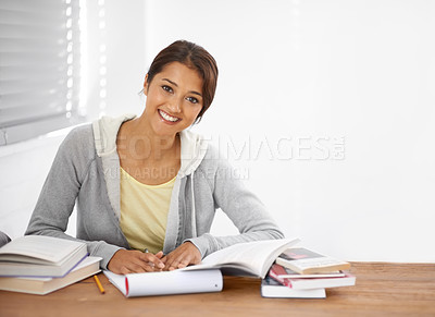 Buy stock photo Student, woman and portrait with books for study, knowledge or education with notes for project in college.
Young person, face and learning at desk with novel for scholarship, happy and assessment